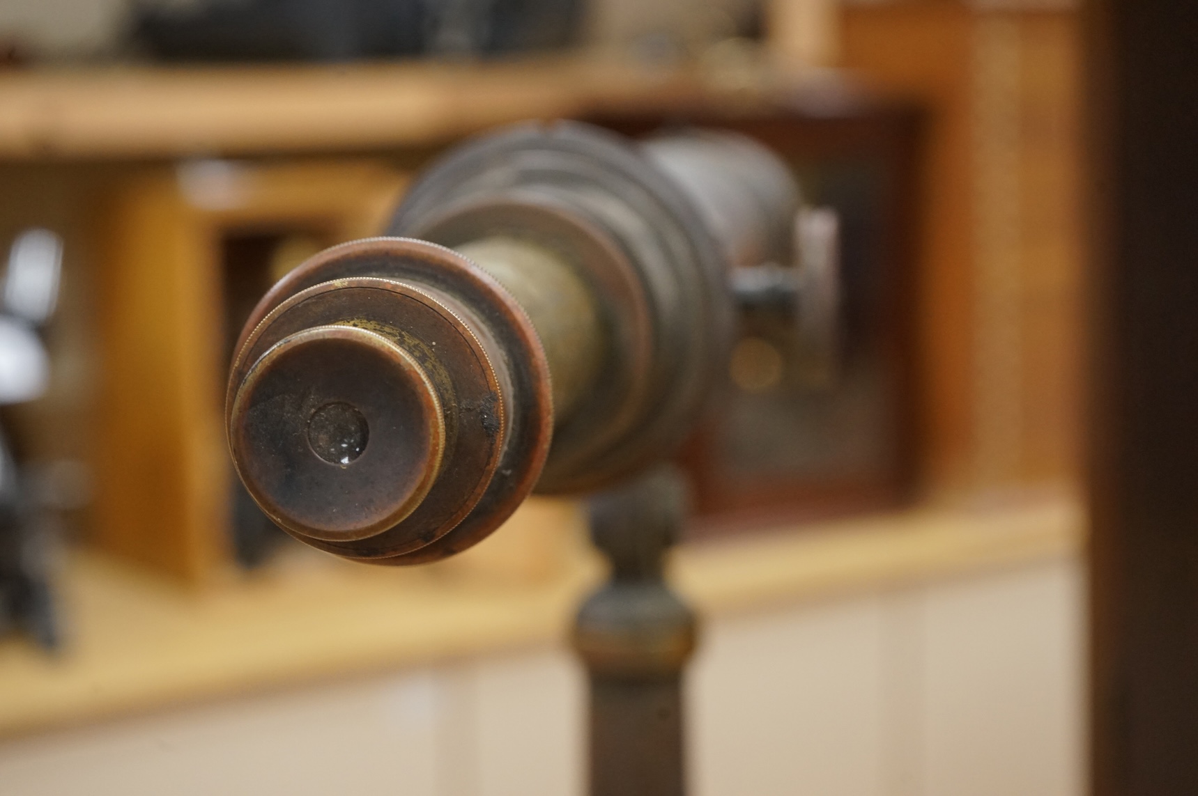 An early 20th century brass two draw telescope on tabletop tripod stand, with engraved dedication; ‘ Computed and Presented by J.W. Gifford. F.R.A.S. Chard 1917’, 73cm long, 48cm high on stand.